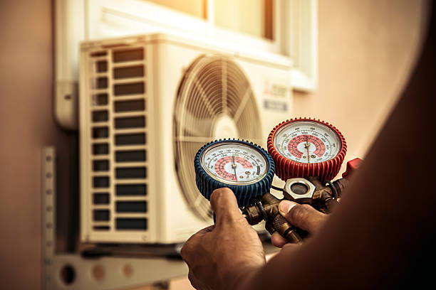 Professional Air Conditioning Service technician working in Absecon, NJ